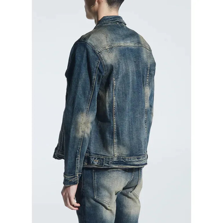 Model wearing Crysp Denim Indigo Dirty Wash Bering Denim Jacket in urban setting