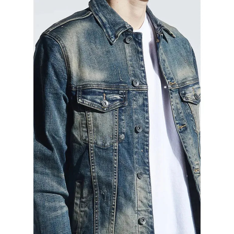 Side view of Crysp Denim Indigo Dirty Wash Bering Denim Jacket (CRYH19-207) with two front pockets and adjustable button cuffs