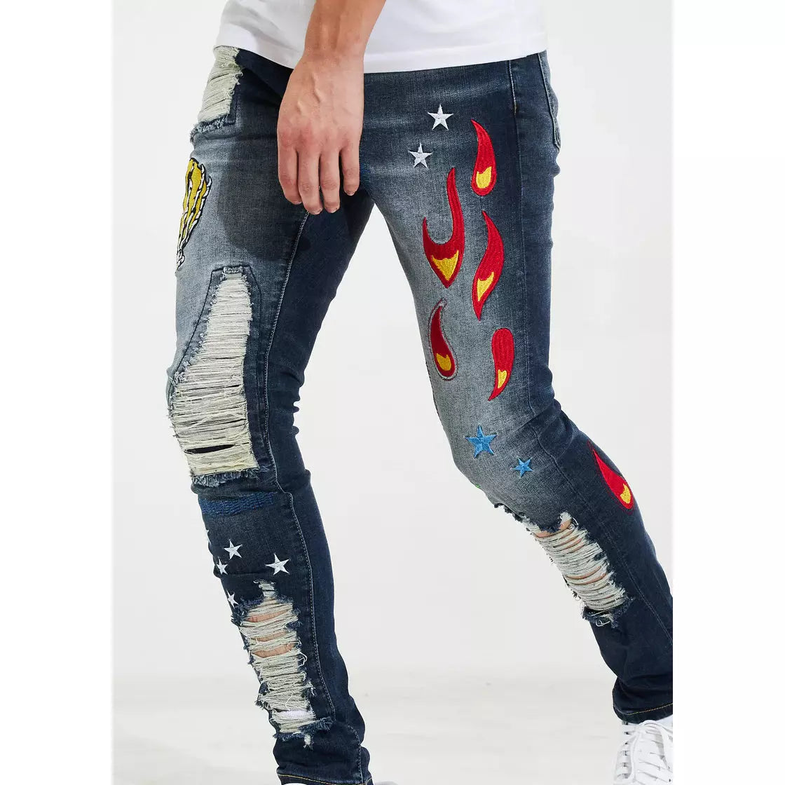 Pair of Crysp Denim Hagan Blue Patchwork Denim Jeans laid flat to showcase the intricate design