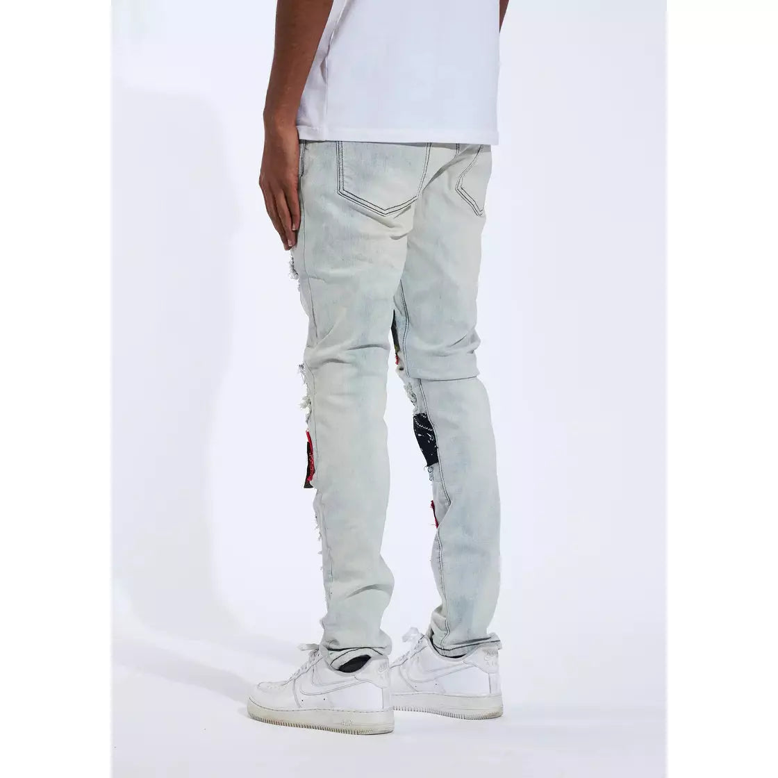 Model wearing Crysp Harvey 20 Light Blue Denim Jeans, styled with a white t-shirt