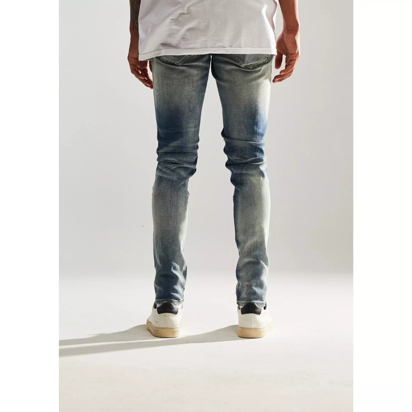 Close-up of Embellish Mont Ripped Denim Jeans in light blue wash, front view
