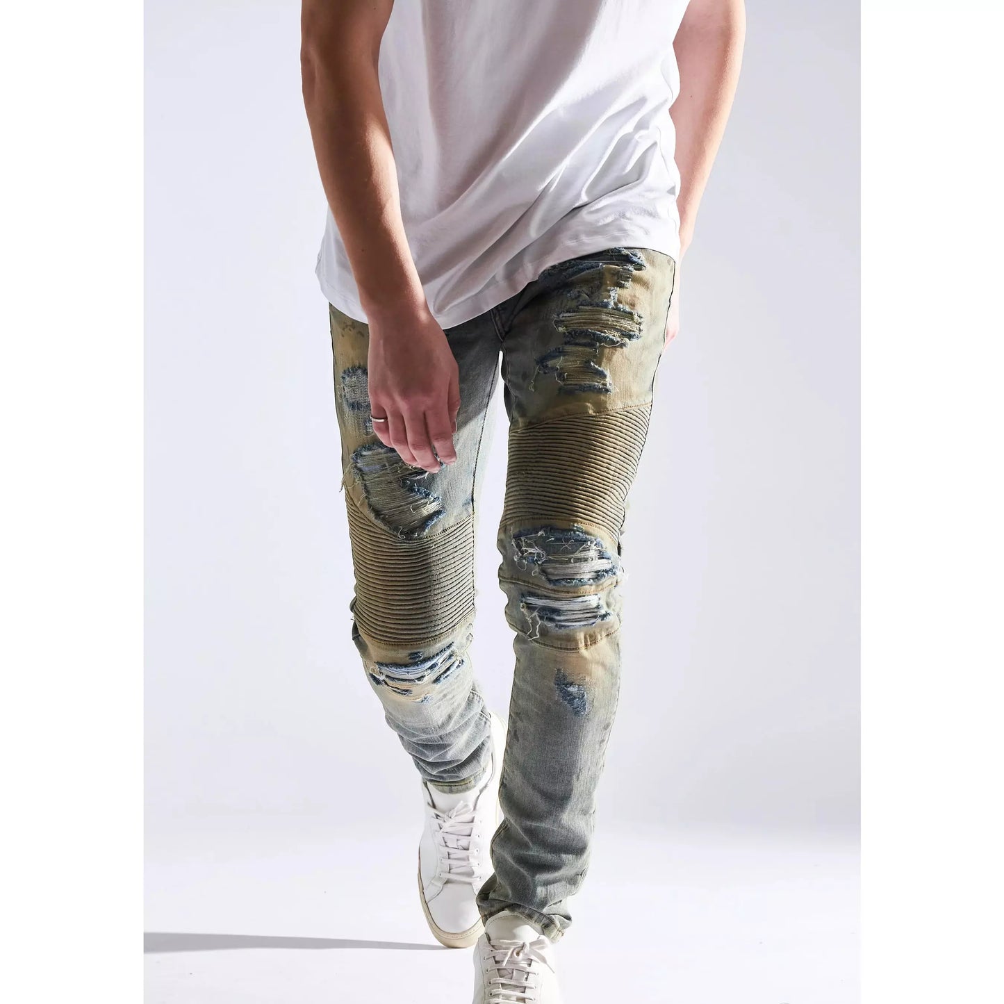 Embellish Fash Biker Denim Jeans with knee and thigh abrasions, angled view