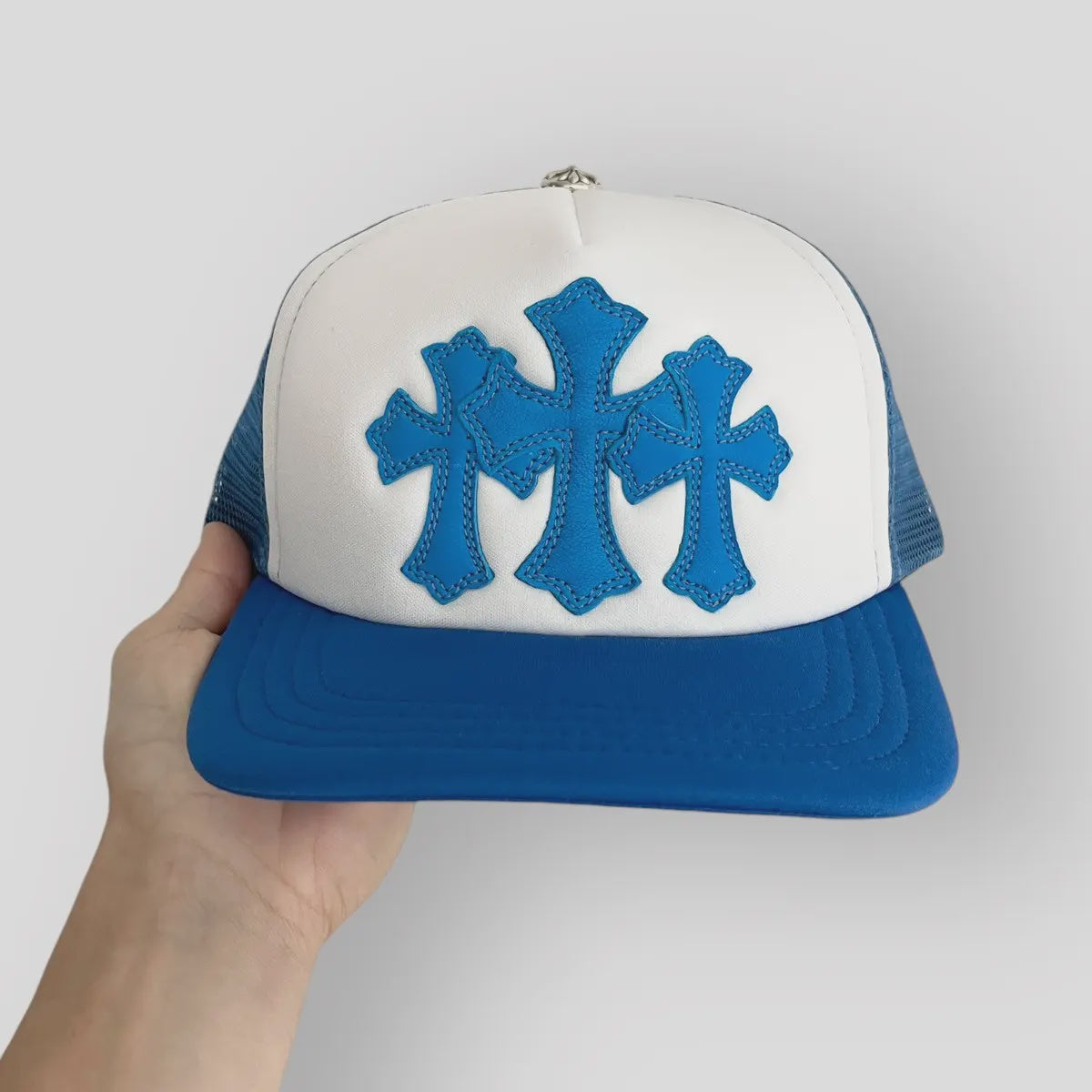 Blue and white Chrome Hearts Cemetery Cross Trucker Hat with iconic logo design