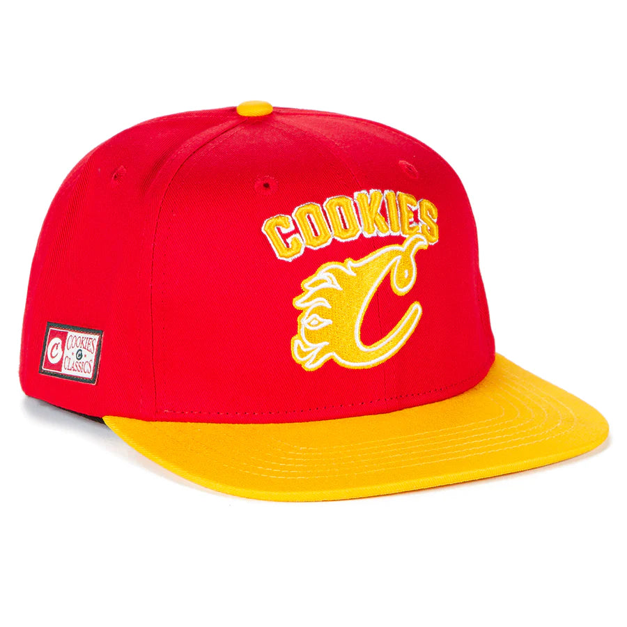 Red snapback hat with 'Cookies Breakaway' logo embroidered on the front