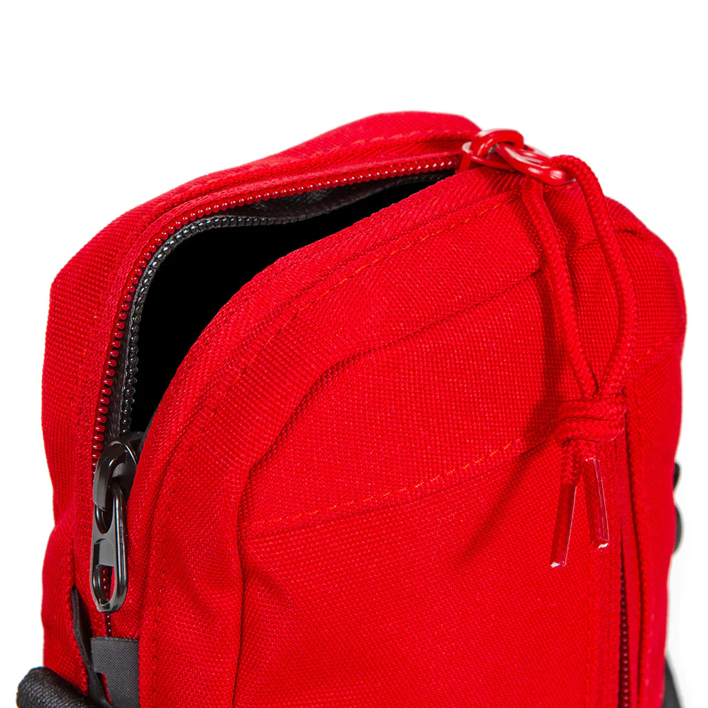 Fashionable red purse with cookie-themed accents and adjustable shoulder strap