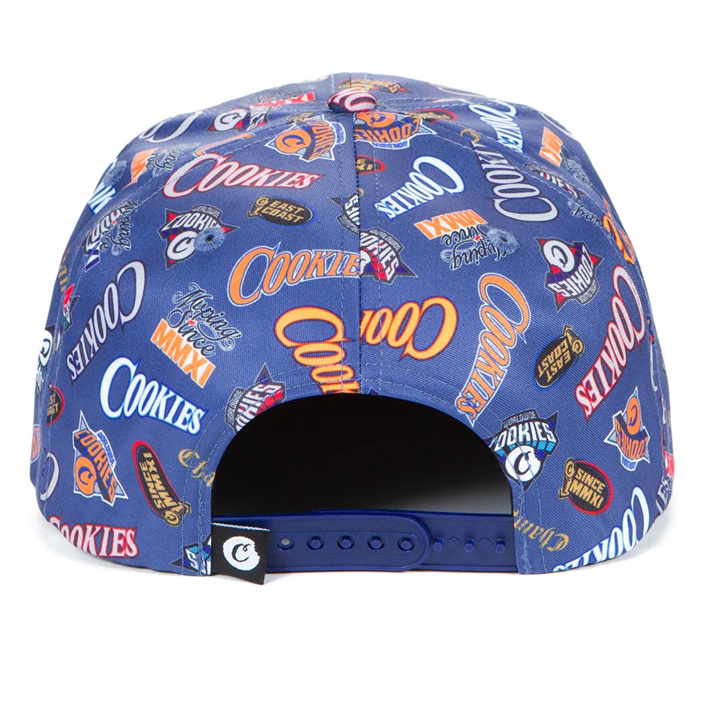 Stylish dark blue snapback with all-over print showcasing the Cookies brand, perfect for casual wear