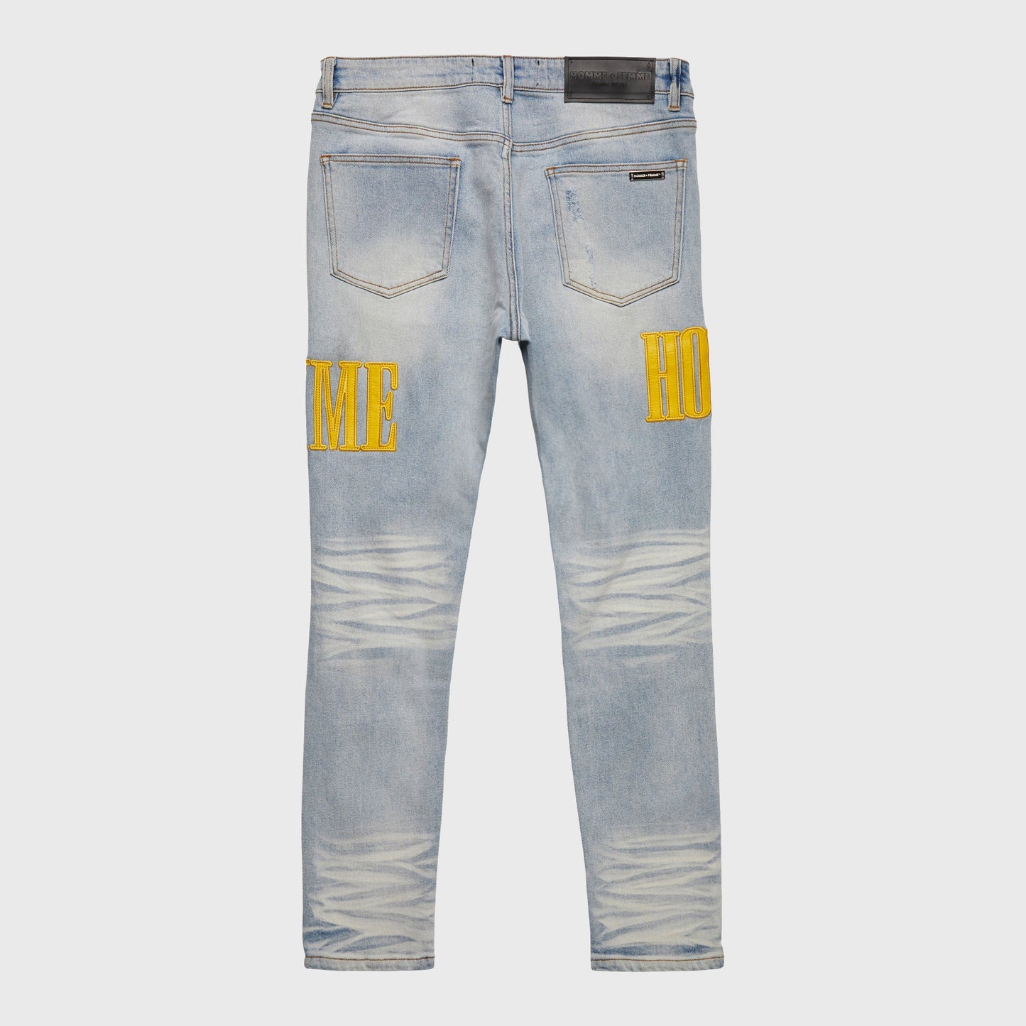 Close-up of the denim fabric and yellow stitching on the Homme + Femme Letterman Denim Blue w/Yellow jacket