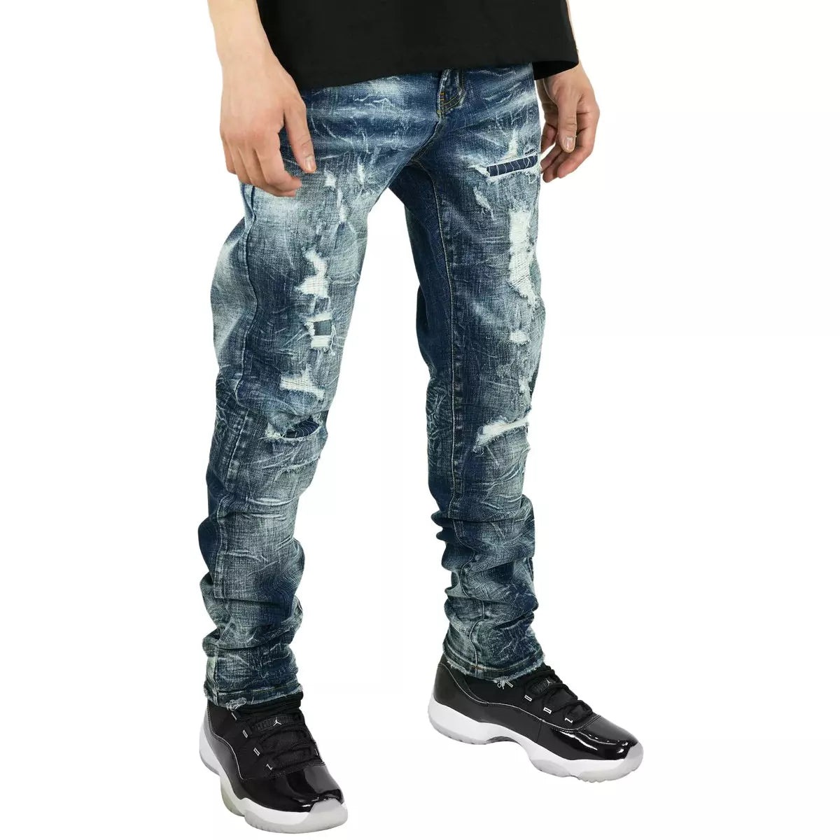 Close-up of the distressed front of PREME Indigo Denim Ripped Jeans (PR-WB-1012) with fading and whiskering
