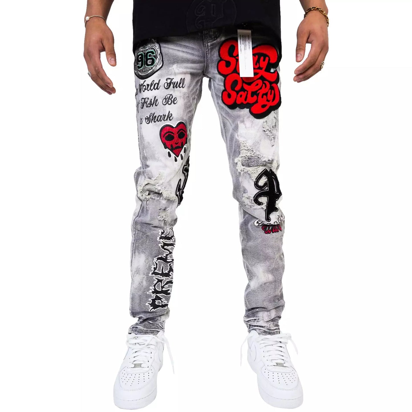 Close-up of PREME Grey Wash Patches Ripped Denim Jeans texture