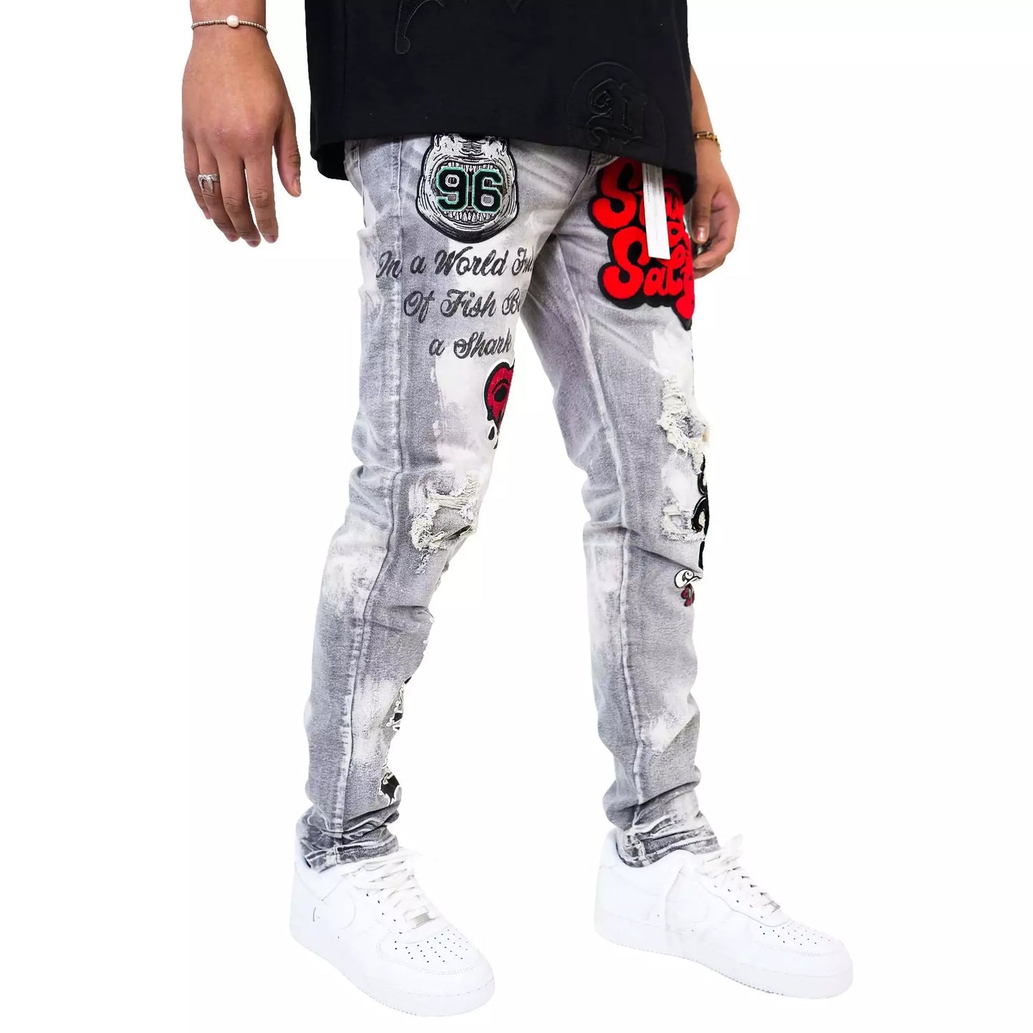 Front view of PREME Grey Wash Patches Ripped Denim Jeans on model