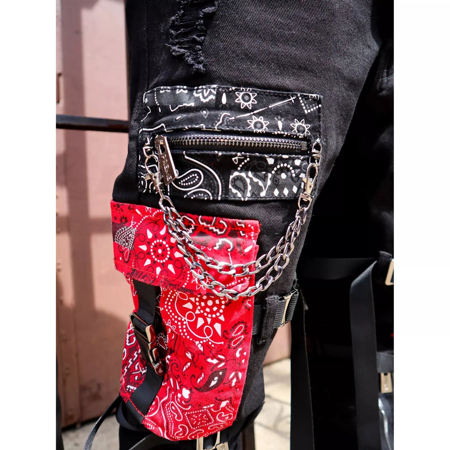 Detail of the distressed and patched design on Preme Black Paisley Patched Denim Jeans