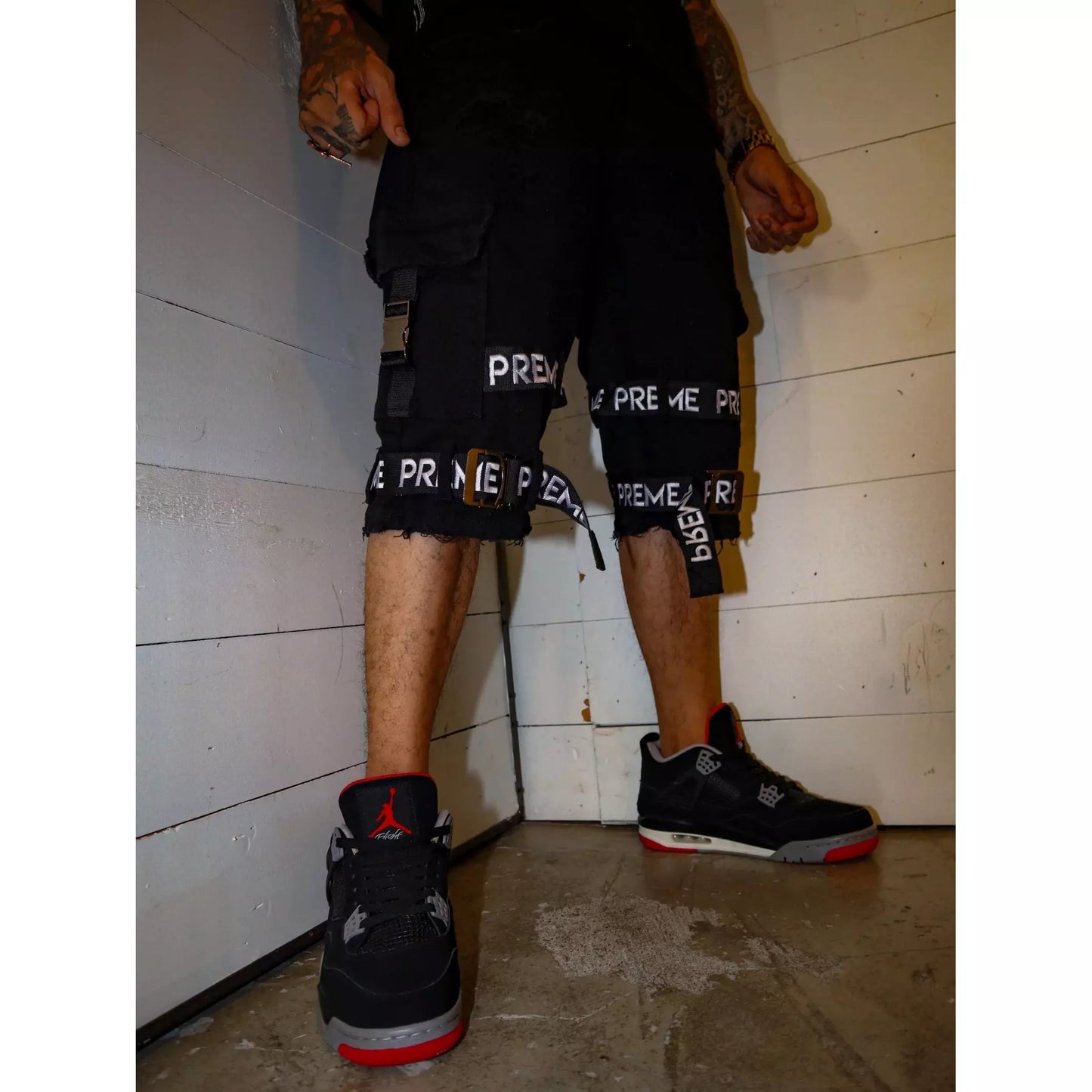 Preme Cargo Shorts with Preme Strap - Black front view with adjustable waistband and multiple pockets for versatile styling