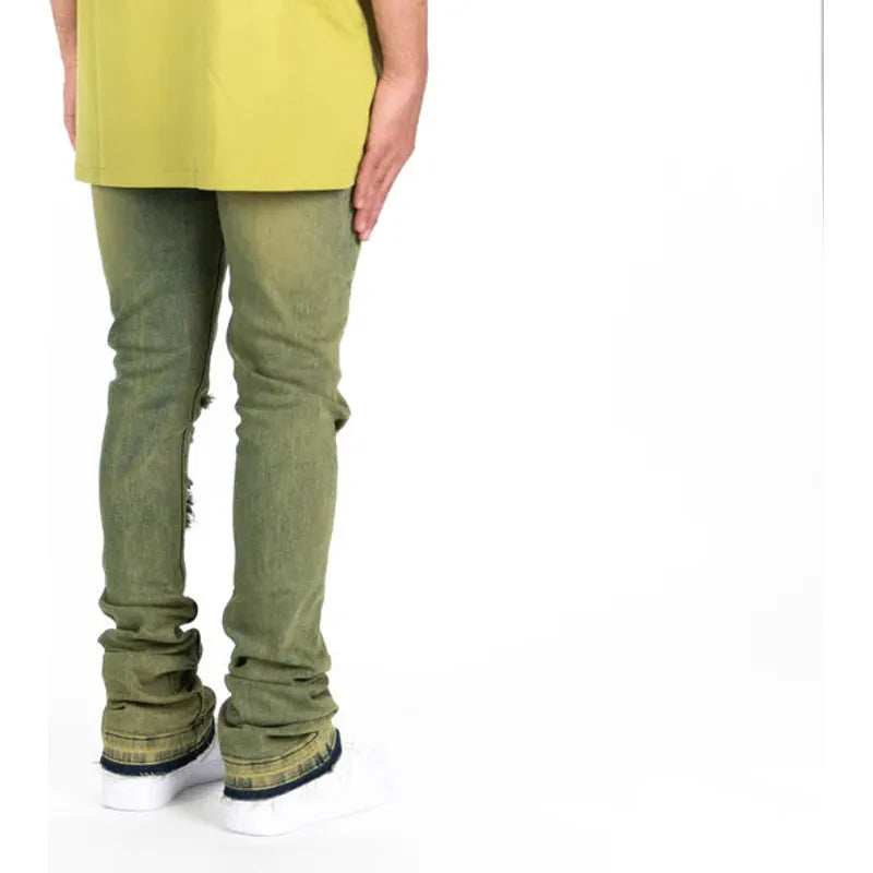 Fashionable woman wearing PHEELINGS Getting There Fern Green Flare Stack Denim in urban setting
