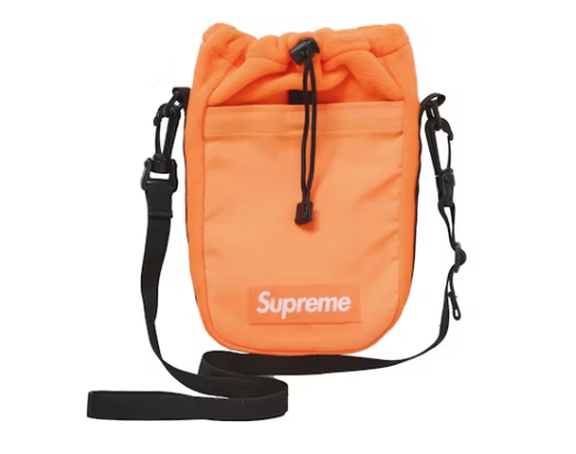An orange Polartec sling bag by Supreme, perfect for outdoor activities