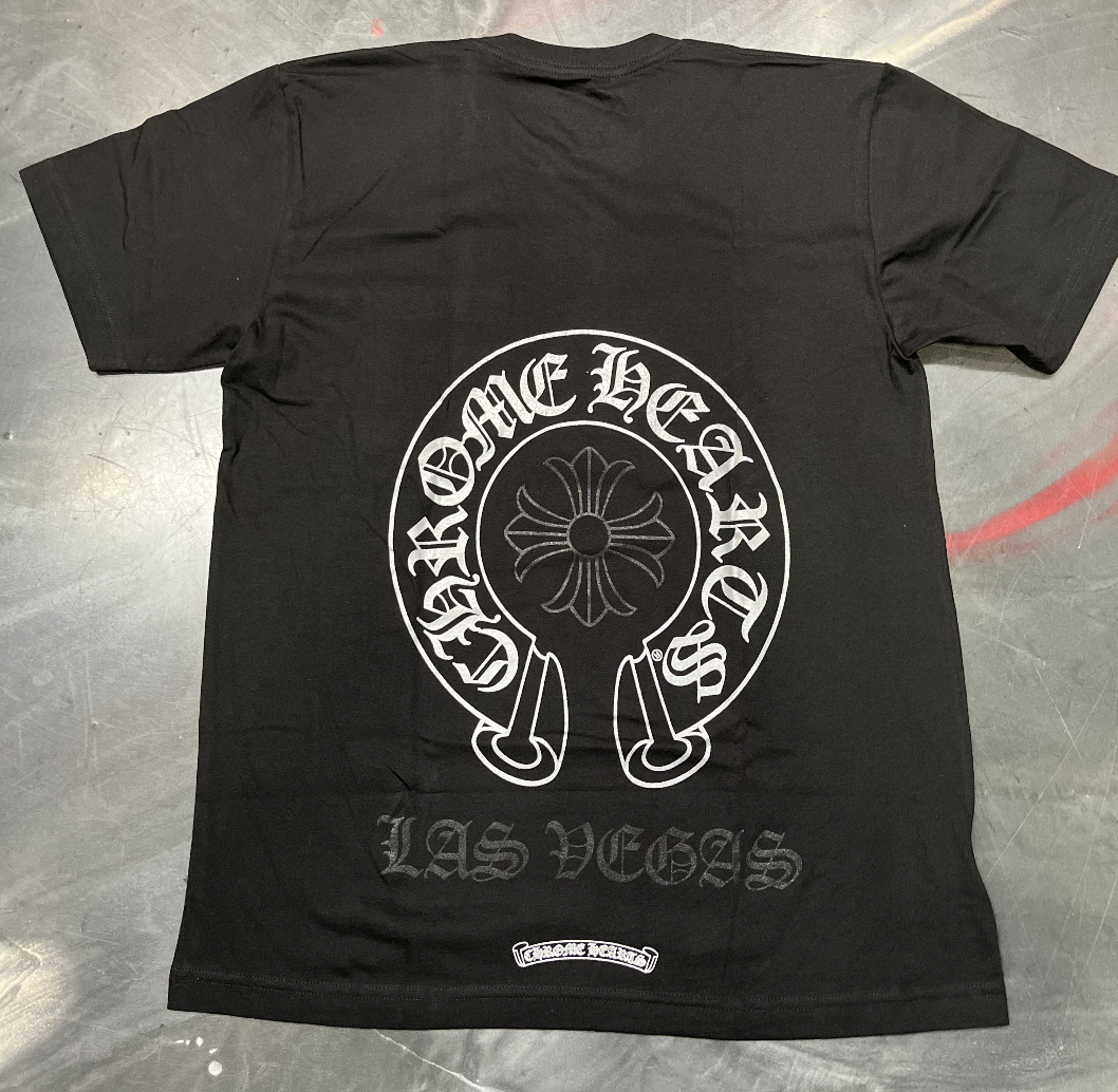 Black and white Chrome Hearts Horseshoe Las Vegas Pocket T-Shirt on display