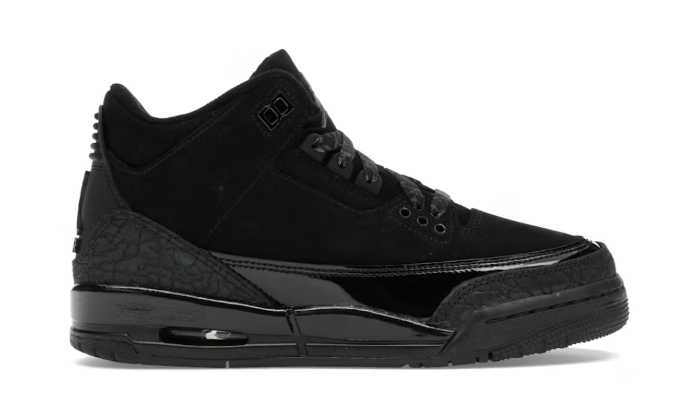 Close-up image of the Jordan 3 Retro Black Cat (GS) sneakers, featuring sleek black design and iconic Jumpman logo on the heel tab, perfect for stylish and athletic wear for kids and teens in 2025 (DM0967-001)