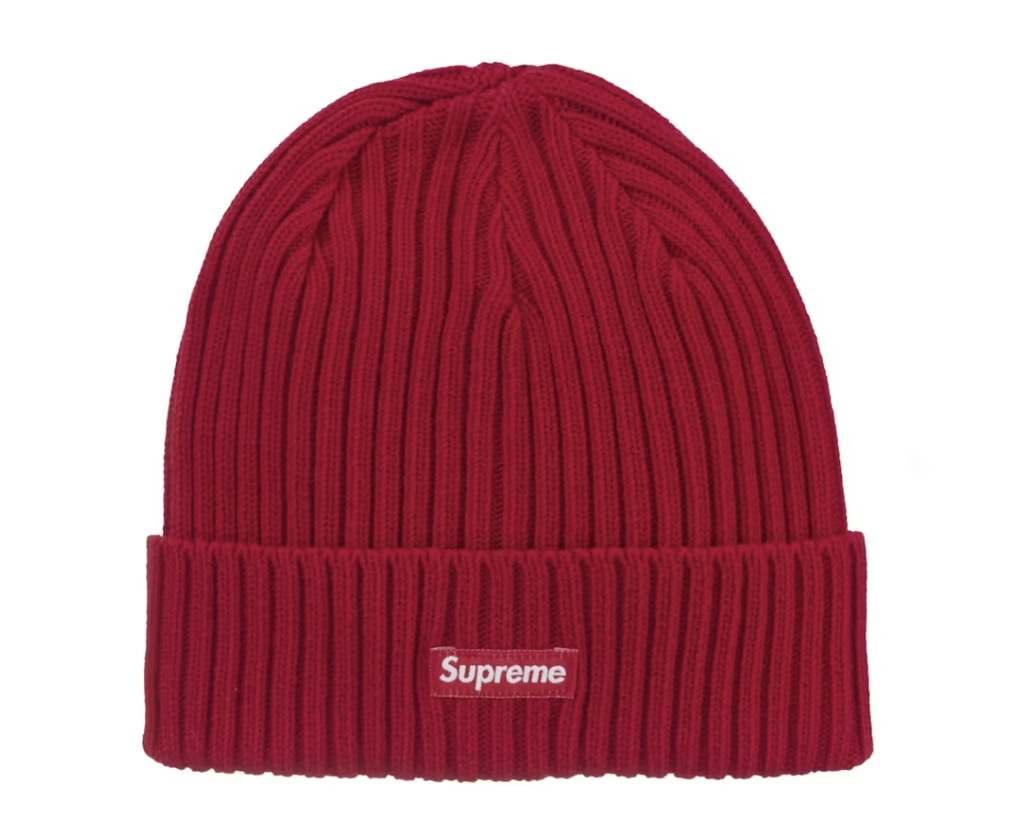 A close-up photo of a brand new, deadstock Supreme Overdyed Beanie in red (SS25)