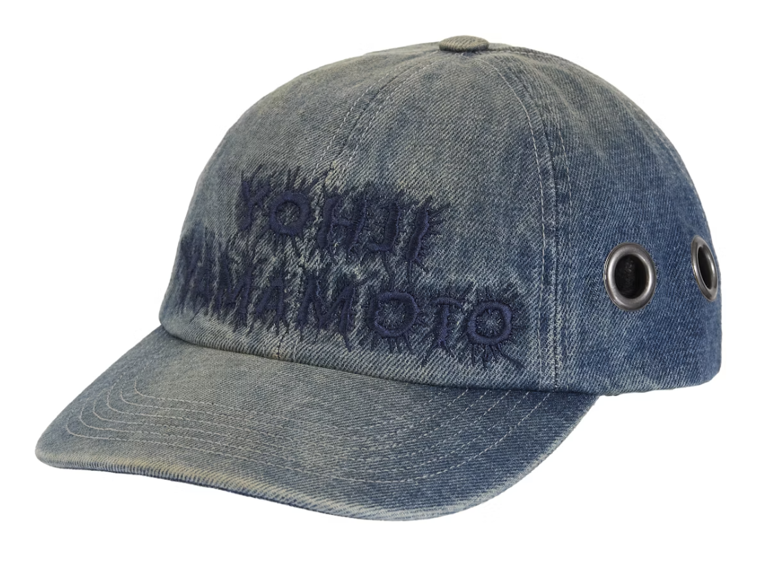 A brand new Supreme Y's By Yohji Yamamoto Grommet 6-Panel in denim fabric from FW25, showcasing a stylish six-panel cap with grommet detailing and deadstock condition