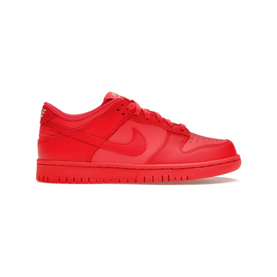 Close-up photo of Nike Dunk Low Track Red sneakers in GS sizes, product code DH9765-601, with red and white colorway and classic Nike swoosh logo