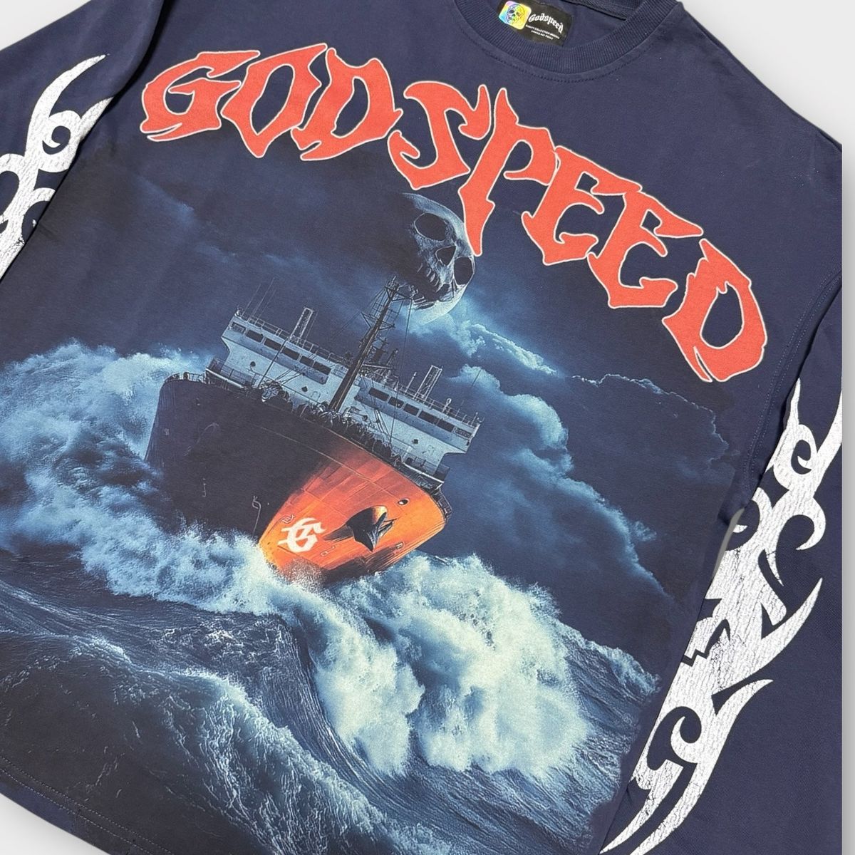 High-quality Godspeed Sea Sick Long Sleeve in navy with a bold Rough seas make good sailors design and decorative stones around the crown