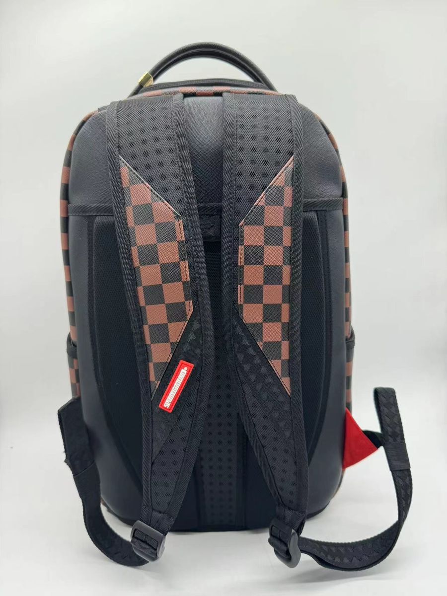 Close-up of the stylish Sprayground Money Grump Backpack featuring vibrant colors, detailed stitching, and spacious compartments suitable for everyday use