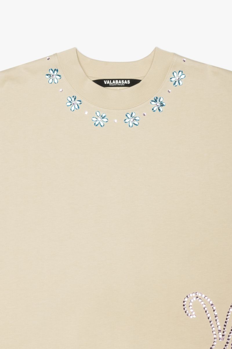Close-up of the Valabasas Gem Cream Tee showing the product code VLBS-VT1-1031 and soft fabric texture