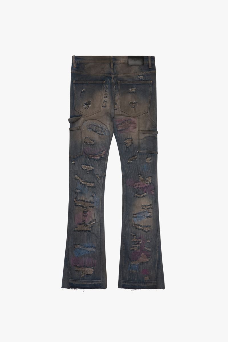 Close up of the Zero Dark Grey Wash Stacked Flare Jeans showing the detailed stitching and distressed fabric