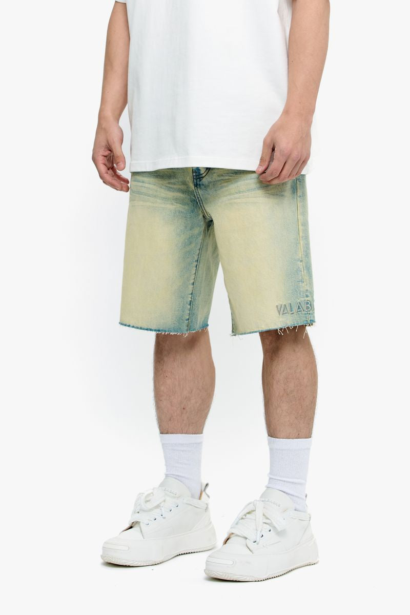 A close-up of Valabasas Mr Shorts vintage wash denim shorts showcasing classic distressed details and rugged denim fabric