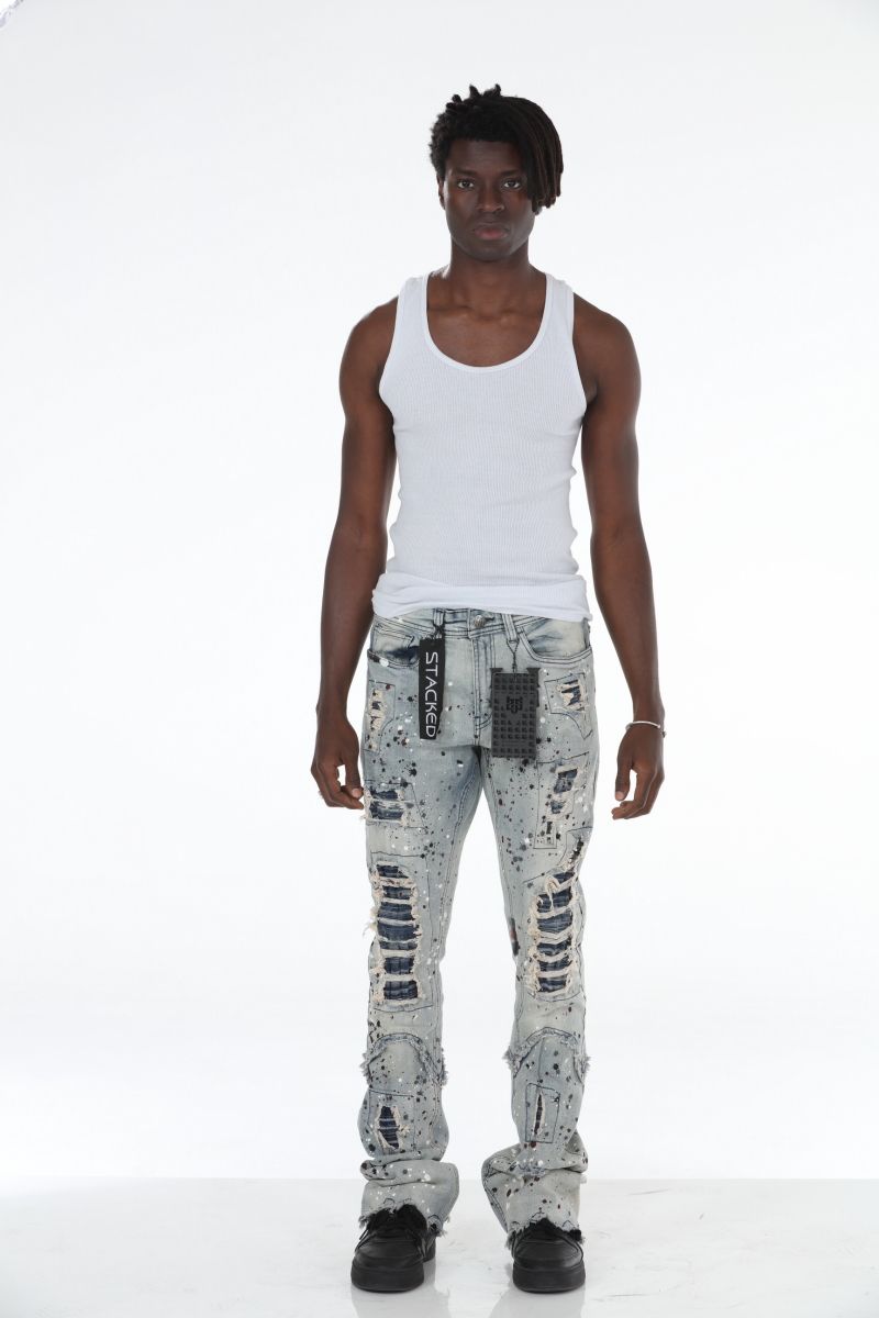Stylish and trendy light blue Stacked Flare Ripped Jeans with paint splatter