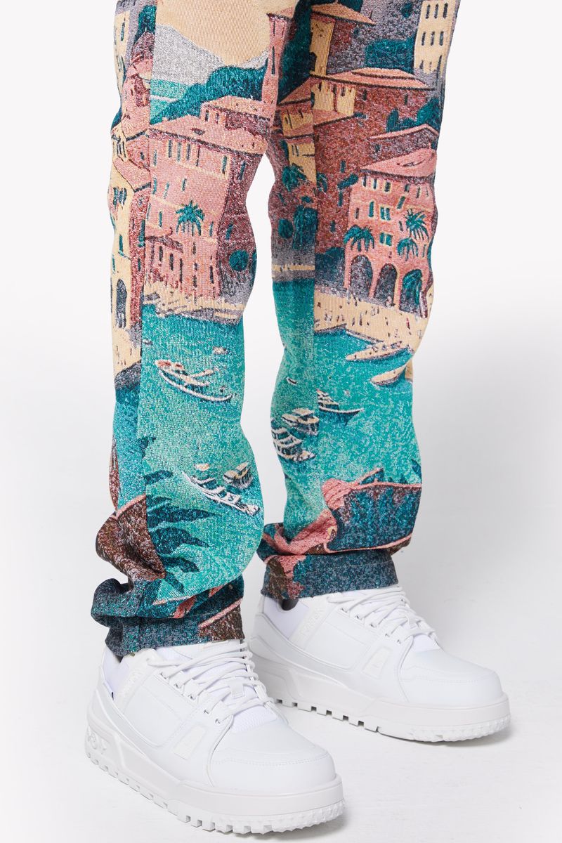 Guapi Portofino Tapestry Pants featuring a vibrant and intricate tapestry design in rich, earthy tones, perfect for adding a touch of bohemian flair to your wardrobe