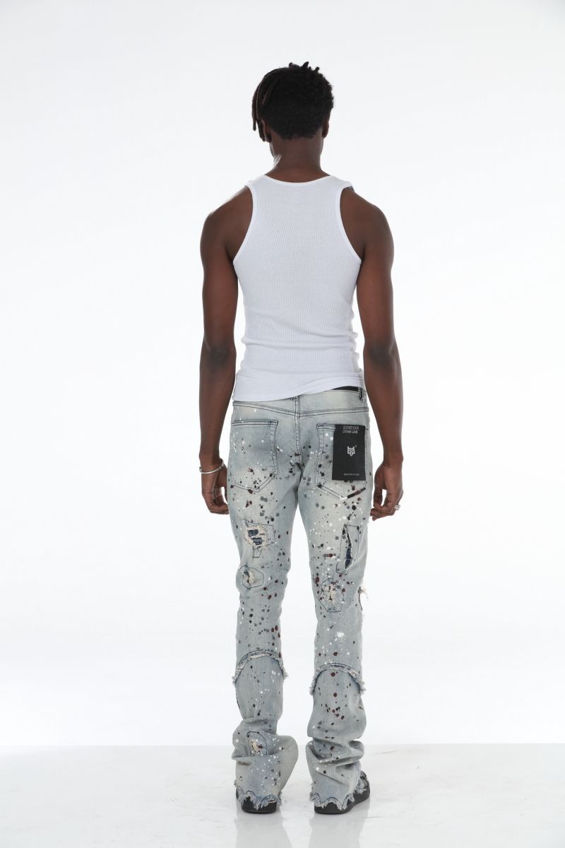 Stylo Stacked Flare Ripped Jeans featuring edgy paint splatter design