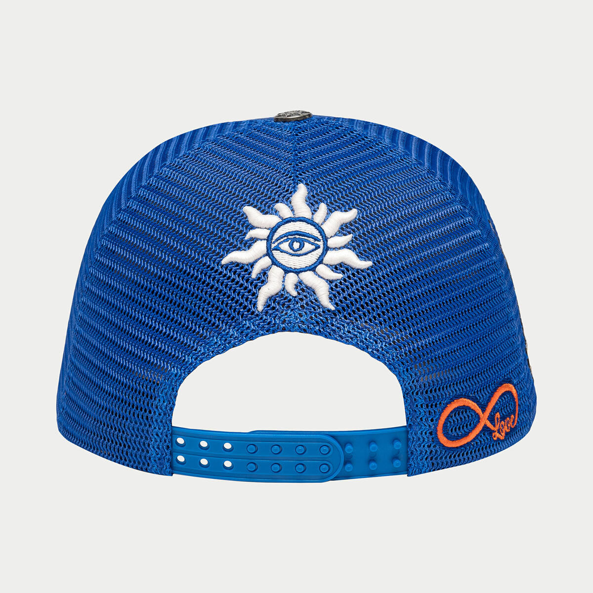 Person wearing the Godspeed OG Dual Patch Trucker Hat in Royal Blue and White, with a focus on the stylish and versatile design