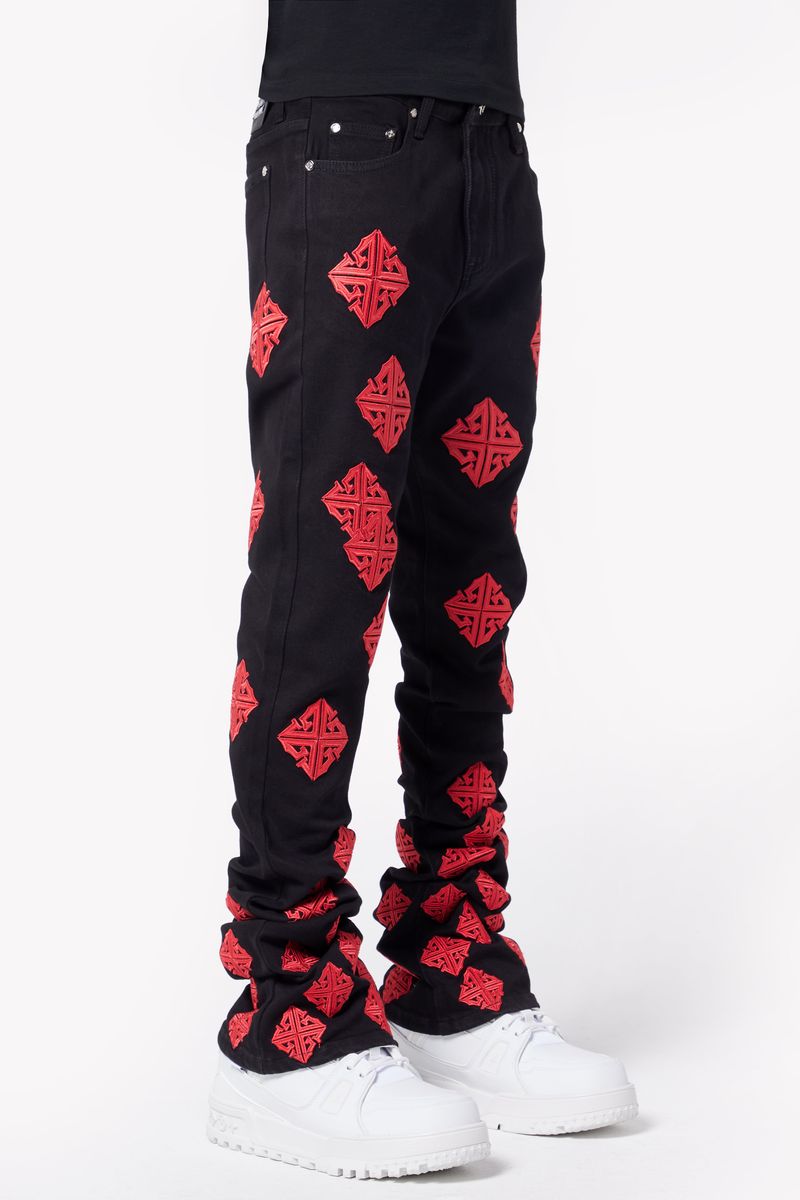 Guapi Crimson Icon Denim Jeans displayed with rolled-up cuffs and trendy cropped length