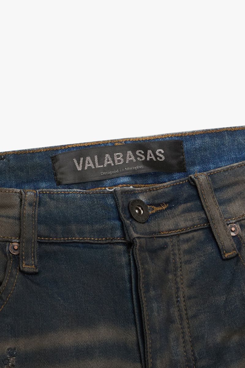Valabasas Zero Dark Grey Wash Stacked Flare Jeans folded and displayed with other denim options on a store shelf