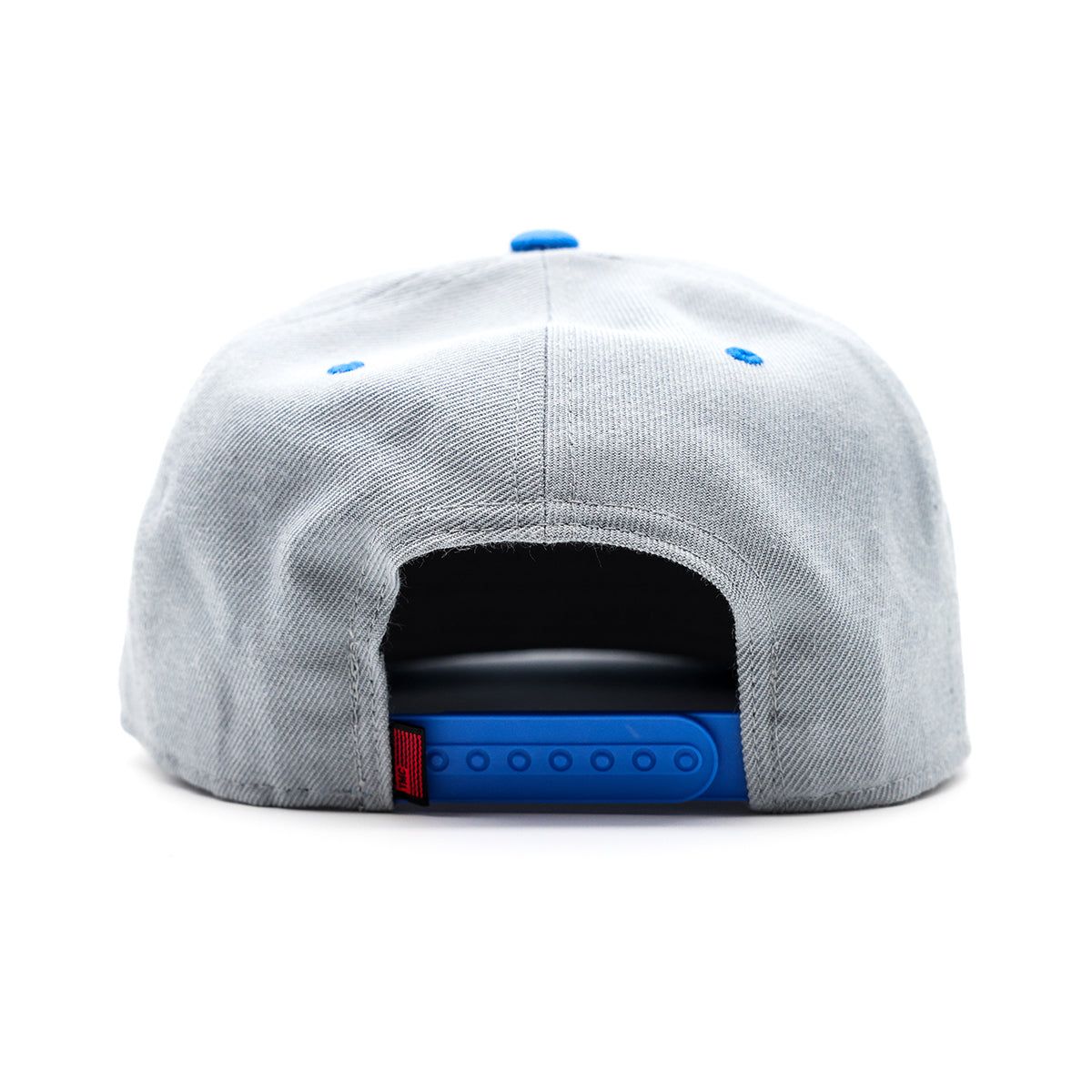 Limited edition snapback with woven TMC Flag label at back and stylish two-tone design