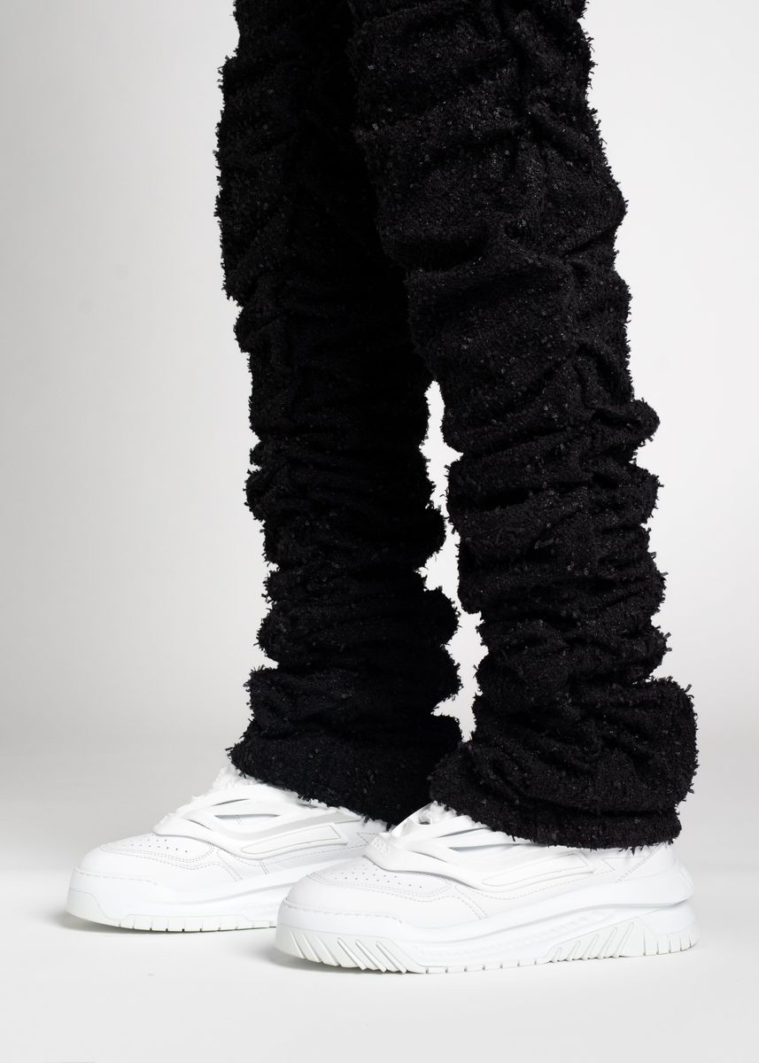 Guapi All Black Super Stacked Denim styled with a black belt and black sneakers