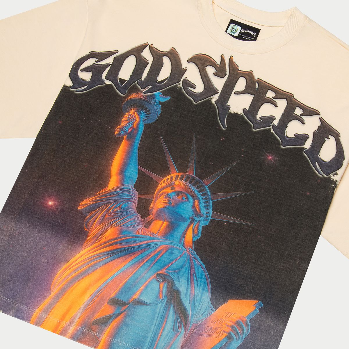 Limited to 444 numbered examples, this mid-weight washed fabric T-shirt showcases a bold graphic with crown stones around the artwork