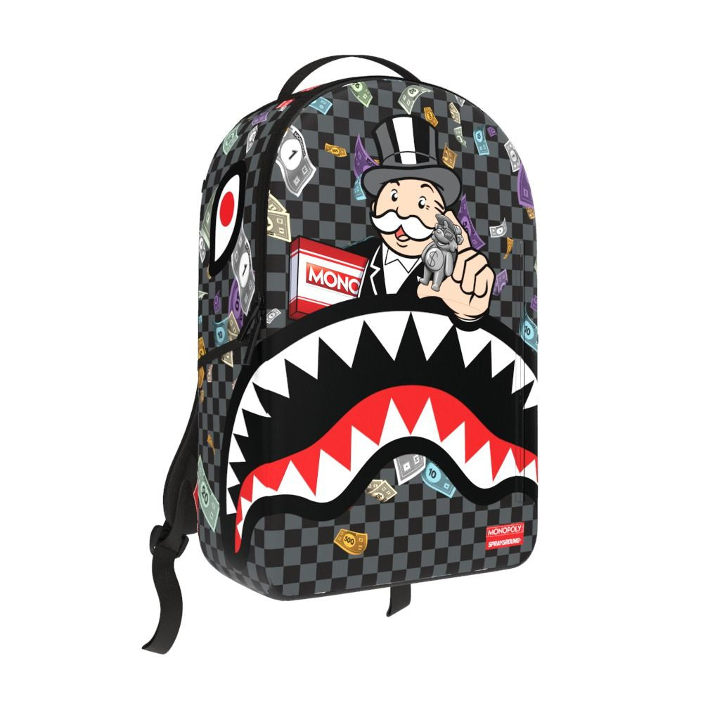 A detailed image of the Sprayground Monopoly X Characters DLXSV Backpack, featuring vibrant Monopoly-themed graphics, measuring 18 inches in height, 115 inches in width, and 65 inches deep, made from durable 100% PVC material