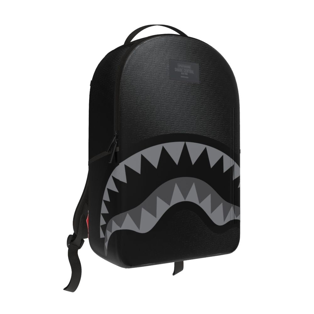 Close-up of the black nylon backpack with shark graphic and spacious main compartment
