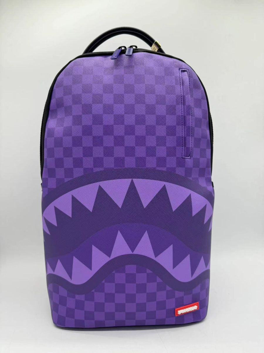 Close-up of Sprayground Purple Sharks In Paris backpack showcasing PVC material and detailed shark graphics