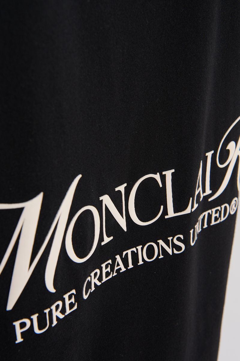 Flat lay image of the PURE Monclair Black T-shirt with specs including fit and material details visible