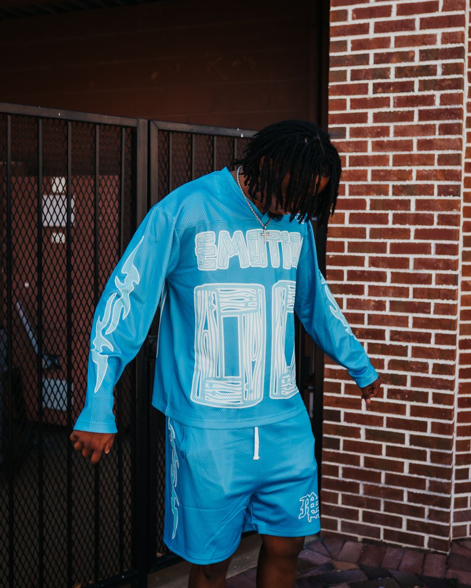 A blue oversized long sleeve shirt featuring a lightning graphic design from Mixed Emotion