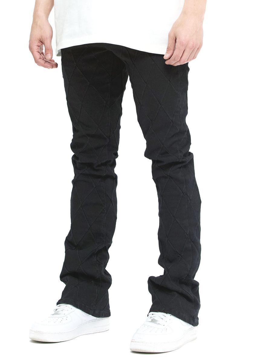 Valabasas Tire Jet Black Stacked Denim Jeans lifestyle shot with urban backdrop