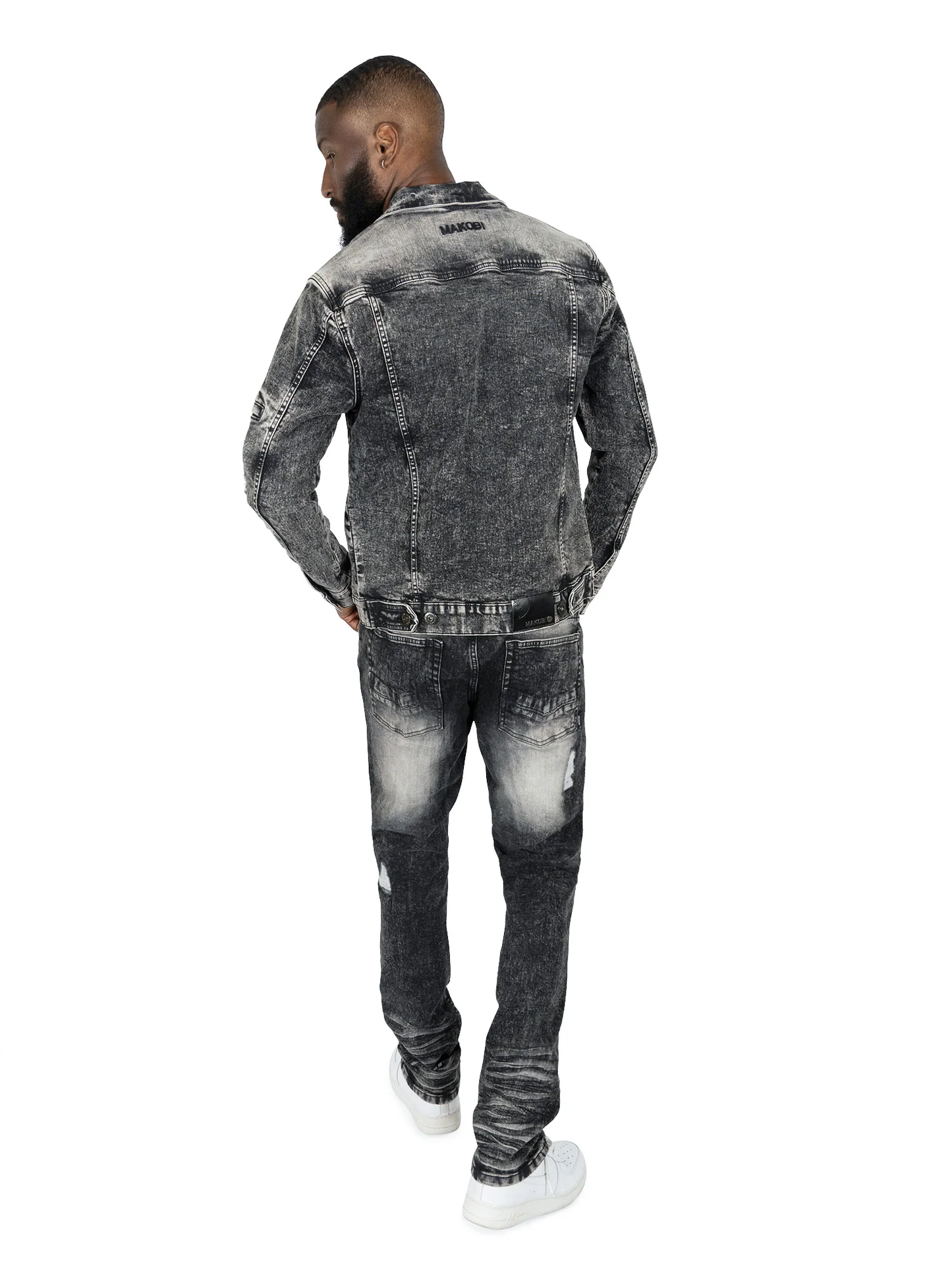 Makobi Moreli Black Wash Denim Jeans displayed on a hanger emphasizing the sleek black wash finish
