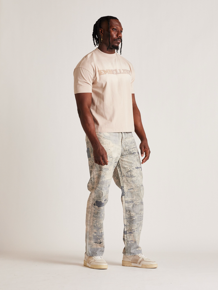 EMBSP25-118 denim jeans with a blended wash and frayed hem