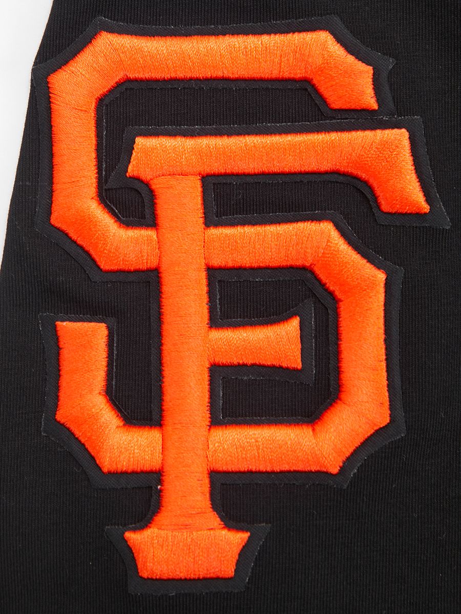 Black San Francisco Giants men's T-shirt featuring iconic team script and decorative tail design