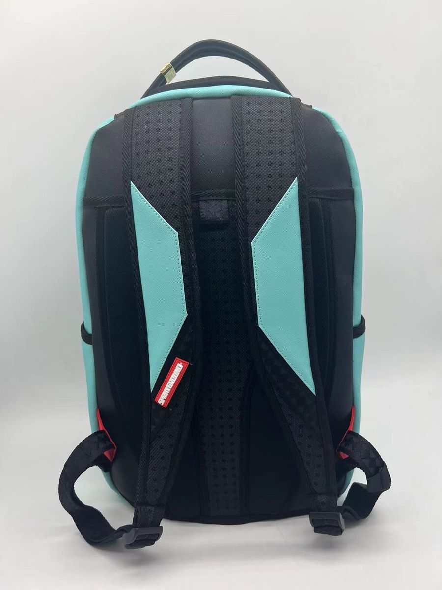 Full view of the Sprayground Shark Central Aqua Backpack with dimensions 18 height, 115 width, and 65 depth