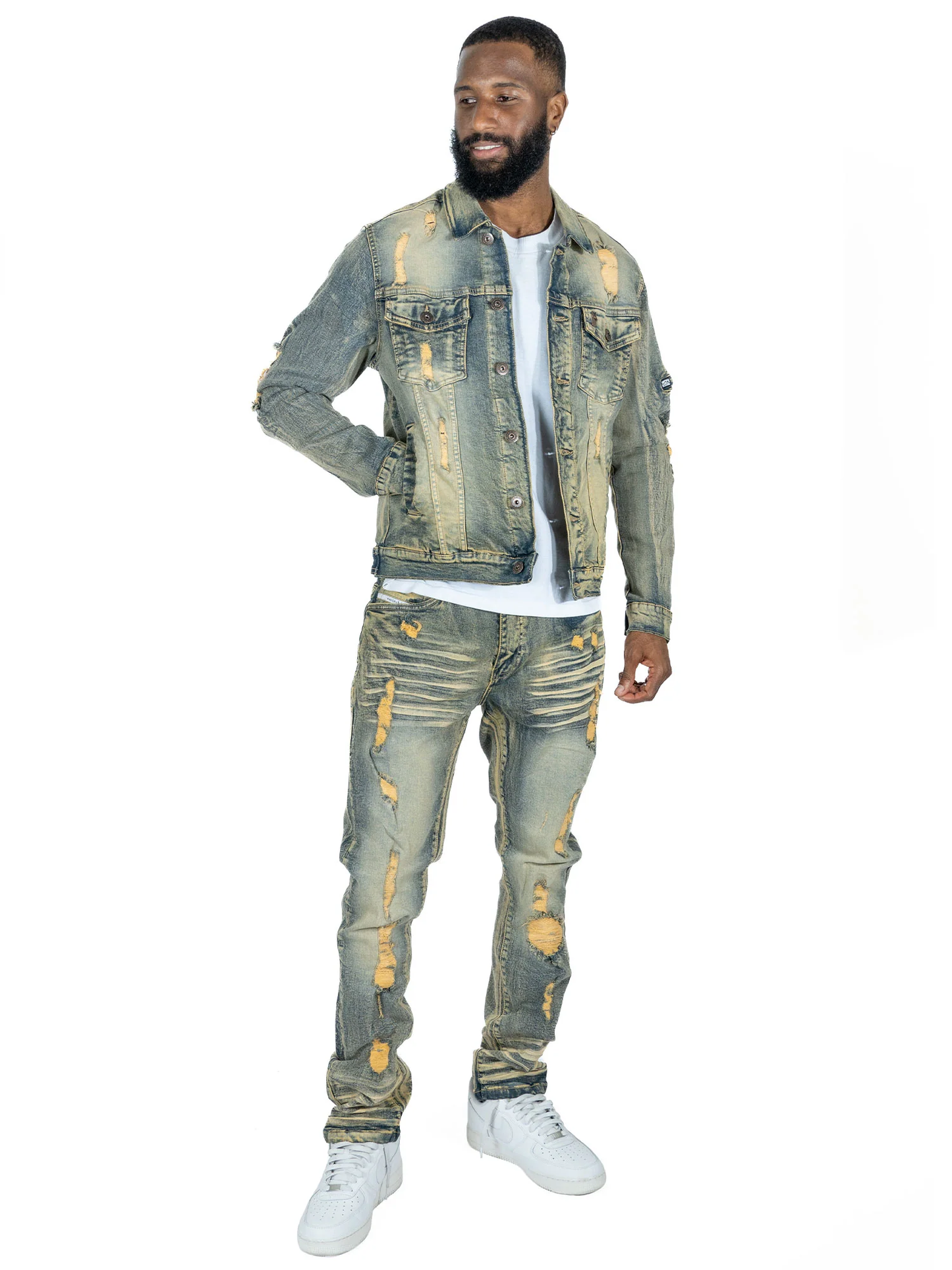 Side angle of Makobi Moreli Dirt Denim Jeans emphasizing the distressed denim texture and stitching