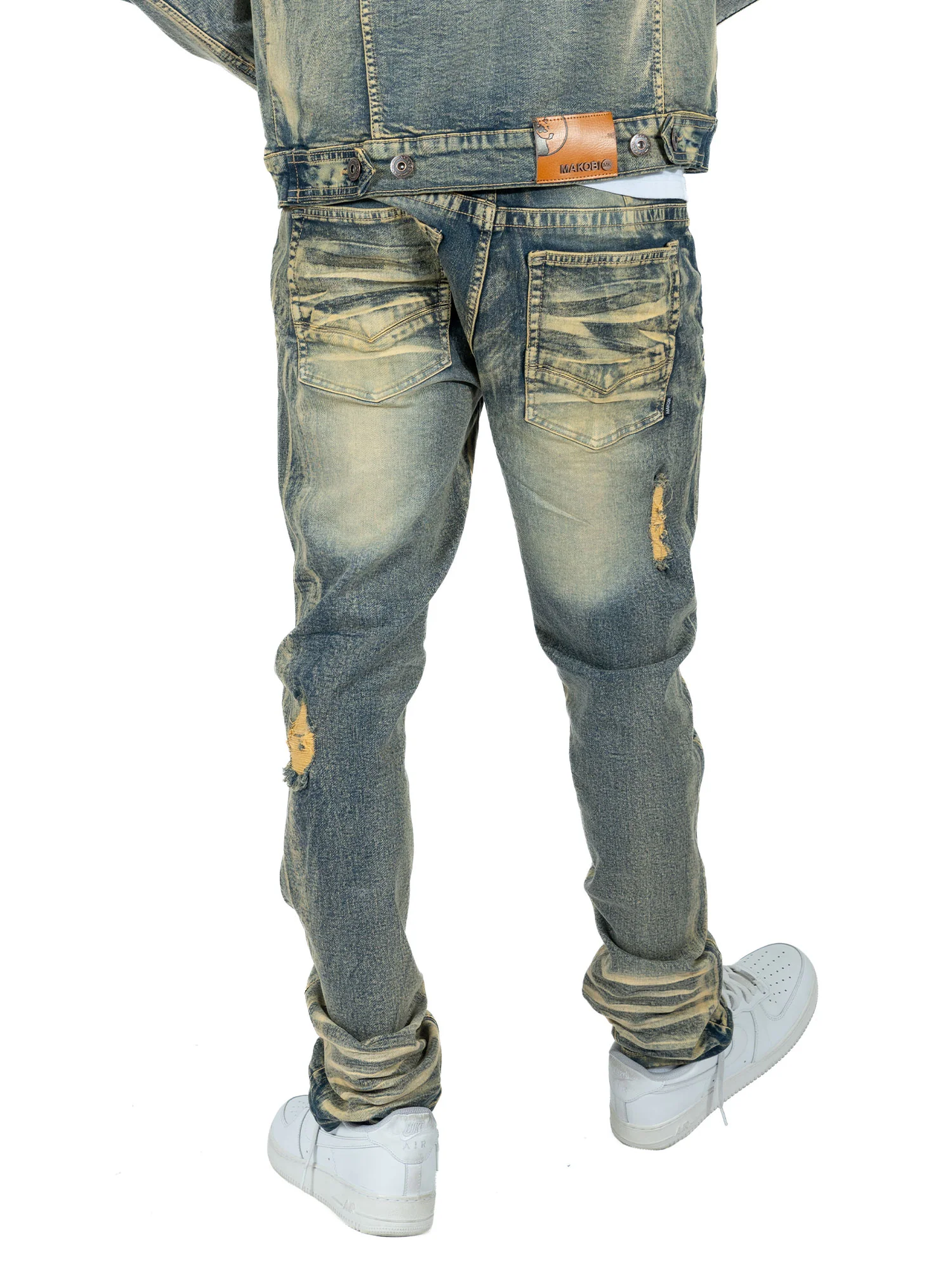 Close-up of Makobi Moreli Dirt Denim Jeans showing rugged dirt-inspired design and durable fabric