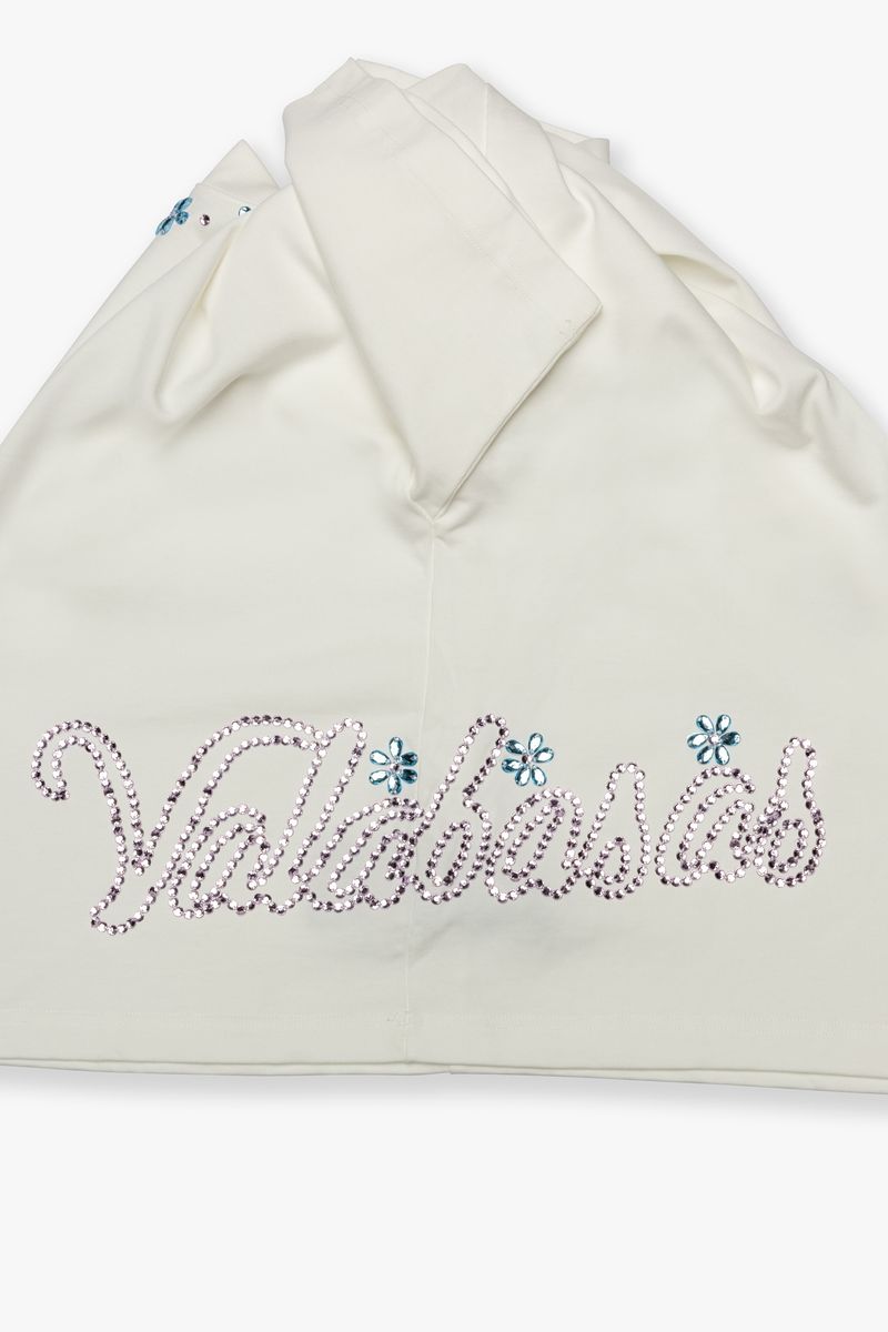 Full view of the Valabasas Gem White Tee styled casually, showcasing its simple yet elegant design